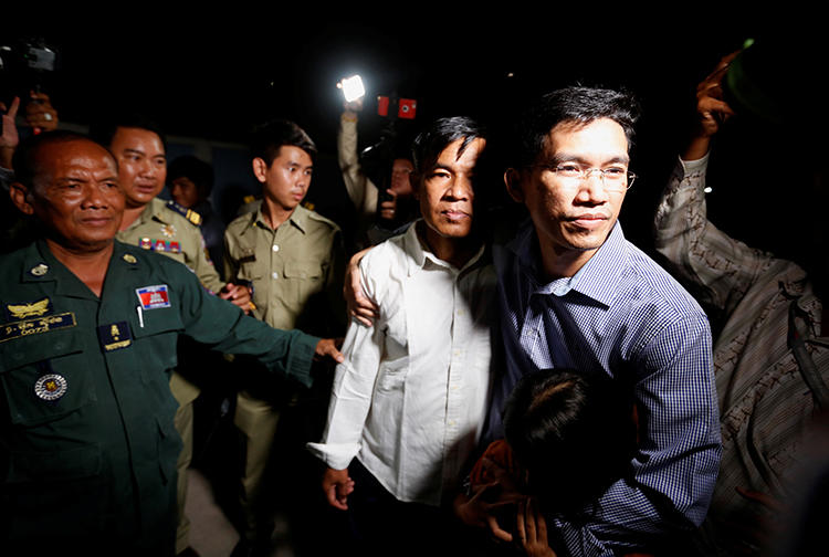 Uon Chhin and Yeang Sothearin, former journalists for Radio Free Asia, are seen in Phnom Penh, Cambodia, on August 21, 2018. The journalists are being tried on espionage charges. (Reuters/Samrang Pring)