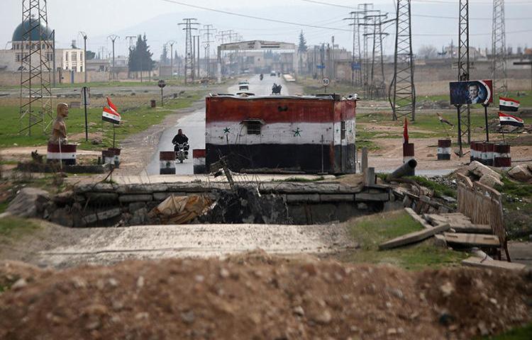 A checkpoint held by Syrian forces loyal to President Bashar al-Assad is pictured in Aleppo, Syria, on February 10, 2018. Security forces recently arrested pro-Assad journalist Rabea Kalawandi in Aleppo. (Reuters/Omar Sanadiki)