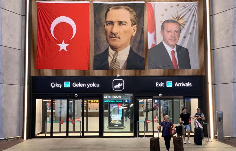 People exit from the international arrivals terminal at the new Istanbul Airport in Istanbul, Turkey, on July 16, 2019. Two documentary filmmakers were sentenced to four and a half years in prison on July 18. (Reuters/Marius Bosch)