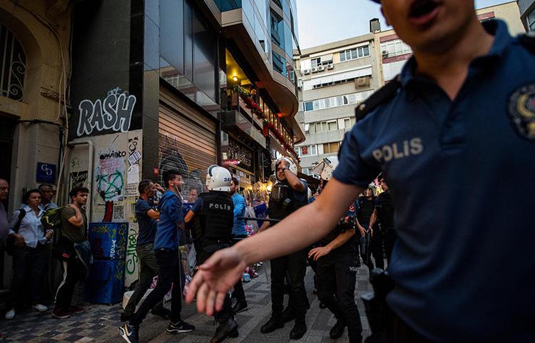 Police detain a protester in Istanbul on August 20, 2019. At least seven journalists were recently arrested throughout Turkey. (AFP/Yasin Akgul)