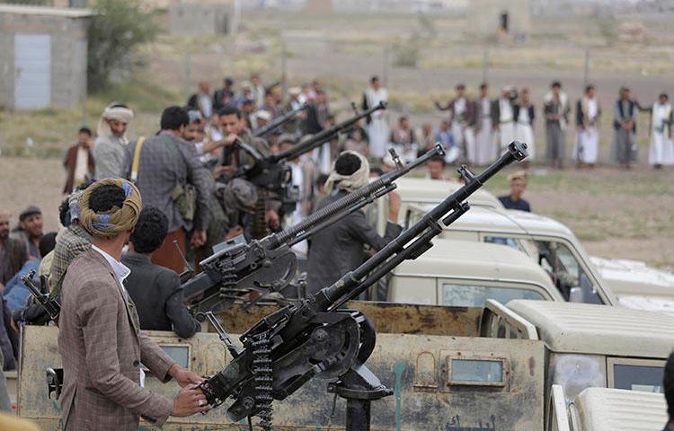 Houthi fighters ride on trucks mounted with weapons during a gathering aimed at mobilizing more fighters for the rebel movement in Sanaa, Yemen, on August 1, 2019. (AP/Hani Mohammed)