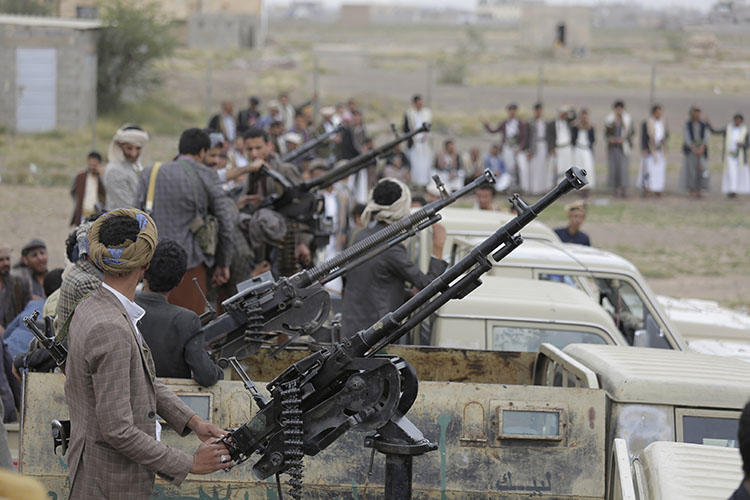 Houthi fighters ride on trucks mounted with weapons during a gathering aimed at mobilizing more fighters for the rebel movement in Sanaa, Yemen, on August 1, 2019. (AP/Hani Mohammed)