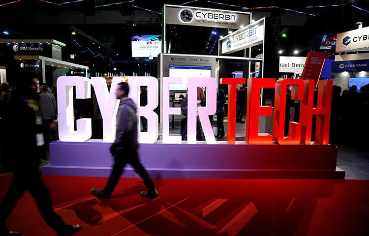 A visitor walks past company exhibition stands at the Cybertech 2019 conference in Tel Aviv, Israel, on January 29, 2019. Reuters reported on August 22, 2019, that Israel has eased export controls on surveillance technologies. (Reuters/Amir Cohen)