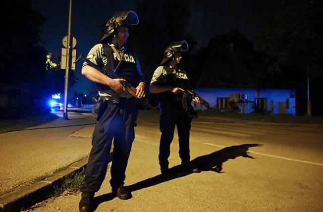 Police officers are seen in Zagreb, Croatia, on August 1, 2019. Police recently arrested journalist Gordan Duhaček in Zagreb. (AFP/Denis Lovrovic)