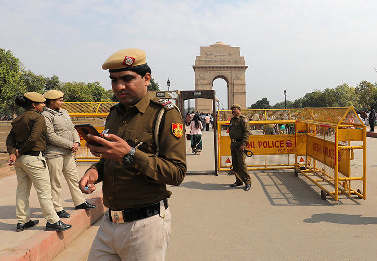 Police are seen in New Delhi, India, on February 27, 2019. Kashmiri journalist Gowhar Geelani was recently barred from leaving the country at a New Delhi airport. (Reuters/Anushree Fadnavis)