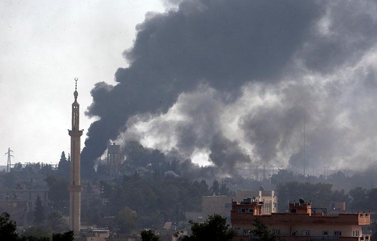 In this photo taken from the Turkish side of the border with Syria, in Akcakale, Sanliurfa province, smoke billows from targets inside Syria during bombardment by Turkish forces on October 10, 2019. Turkey has banned critical reports on the assault. (AP/Lefteris Pitarakis)