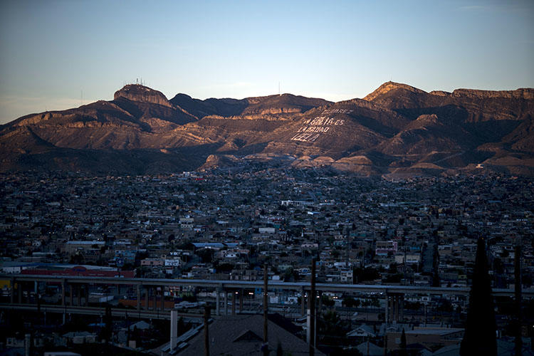 Ciudad Juarez in Mexico is pictured nestled against El Paso, Texas. A member of a National Geographic crew was shot in the leg when gunmen attacked a residence where the group was interviewing an alleged gang member. (Paul Ratje/AFP)