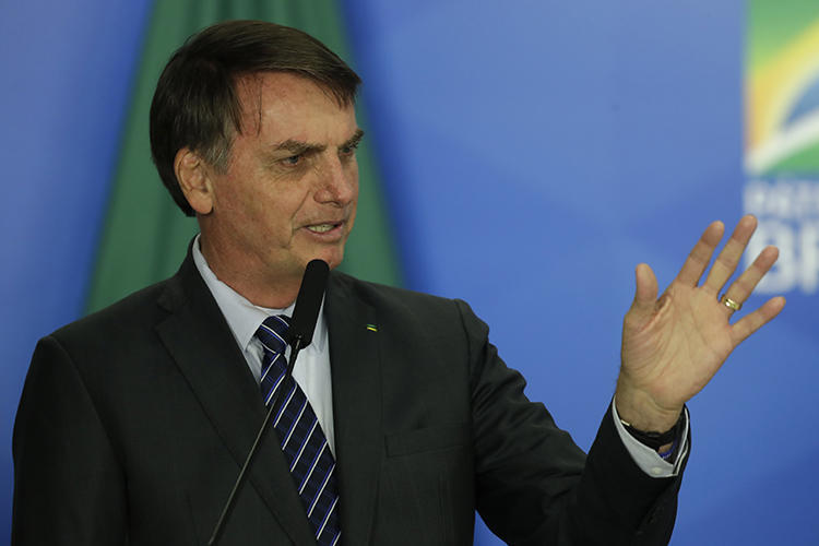 Brazilian President Jair Bolsonaro is seen in Brasilia on October 8, 2019. Bolsonaro recently insulted and threatened the Globo media company. (AP/Eraldo Peres)