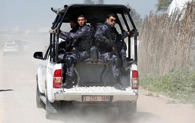 Members of Palestinian Hamas security forces are seen in the Gaza Strip on March 13, 2018. Security forces recently arrested journalist Hani al-Agha. (Reuters/Mohammed Salem)