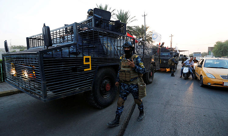 An Iraqi federal police officer is seen in Baghdad on October 7, 2019. Iraqi blogger Shojaa Fares al-Khafaji was recently detained by unidentified men. (Reuters/Wissm al-Okili)