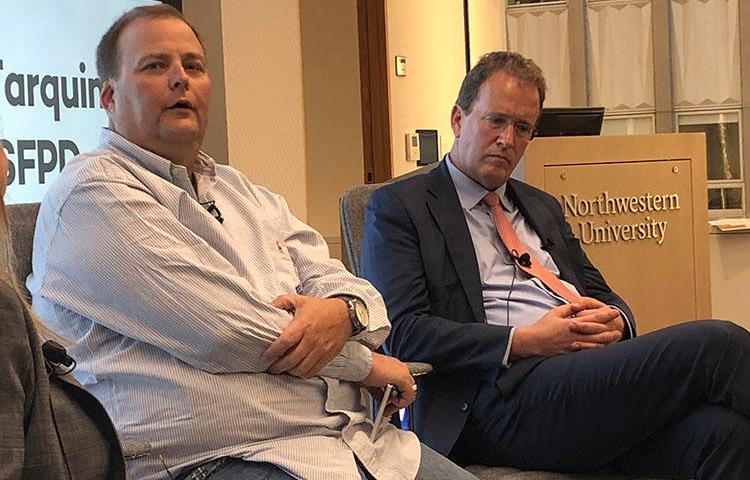 Freelance journalist Bryan Carmody, left, is seen with his attorney, Thomas Burke, at a panel event held by the Society of Professional Journalists in San Francisco on August 13, 2019. Police raided Carmody's home and office in May while investigating the leak of a report on the death of a San Francisco public defender. (AP/Juliet Williams)