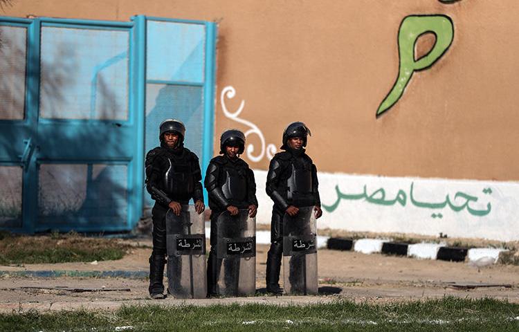 Police officers are seen in Alexandria, Egypt, on November 20, 2019. Police recently arrested journalists Solafa Sallam, Hossam El-Sayyad, and Mohamed Salah in Giza. (AFP/Mohamed El-Shahed)