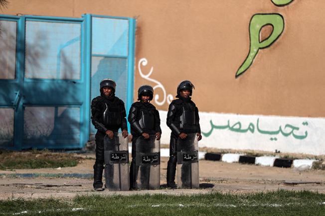 Police officers are seen in Alexandria, Egypt, on November 20, 2019. Police recently arrested journalists Solafa Sallam, Hossam El-Sayyad, and Mohamed Salah in Giza. (AFP/Mohamed El-Shahed)