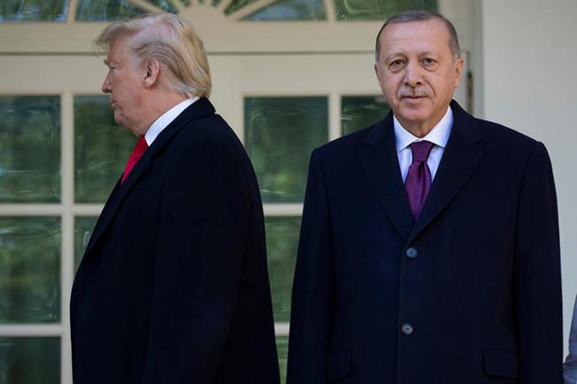 President Donald Trump walks toward the Oval Office after posing for photographers with Turkey's President Recep Tayyip Erdoğan on November 13. Turkey detained at least six journalists in the same week as Erdoğan's visit to the U.S. (AP/Evan Vucci)