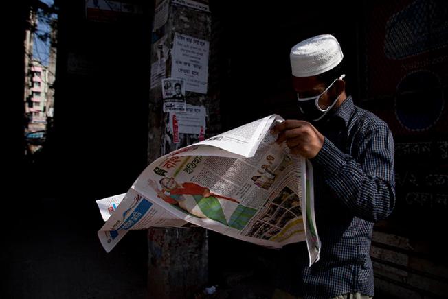 A man reads a newspaper in Dhaka, Bangladesh, on December 31, 2018. Police recently arrested and detained newspaper editor Abdul Asad. (AP/Anupam Nath)