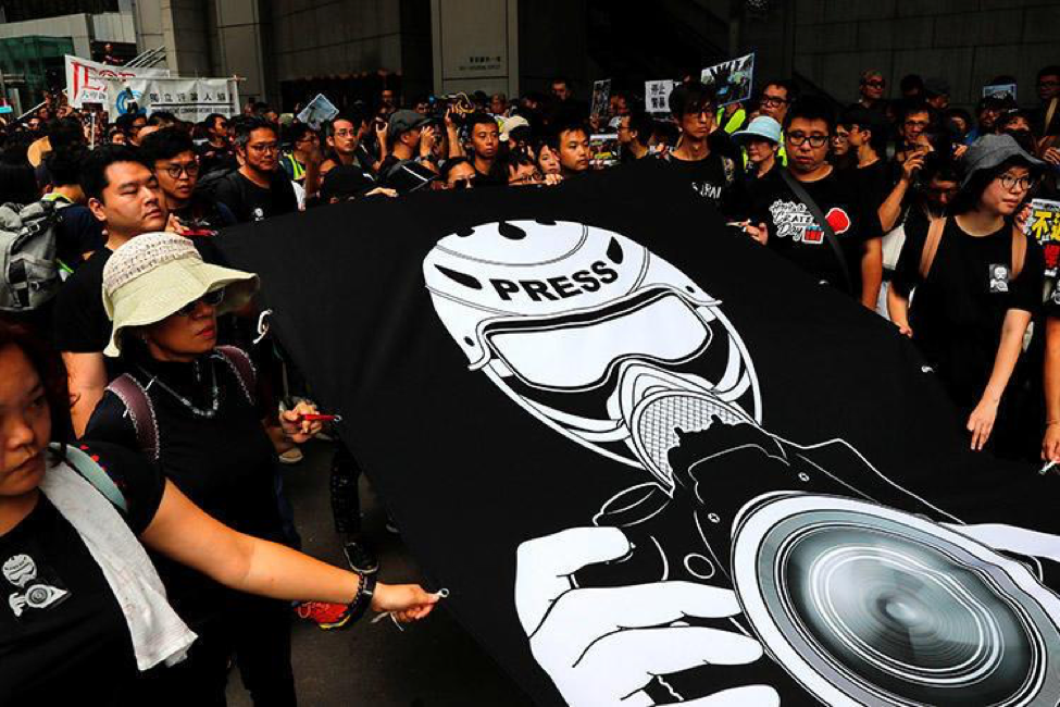 Journalists and supporters demonstrate against the police treatment of media during protests in Hong Kong on July 14, 2019. (Reuters/Tyrone Siu)