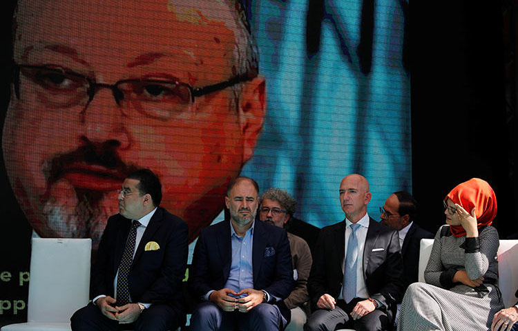 Hatice Cengiz, fiancée of murdered Saudi journalist Jamal Khashoggi, and Jeff Bezos, owner of The Washington Post, attend a ceremony marking the anniversary of Khashoggi's killing on October 2, 2019. (Reuters/Umit Bektas)