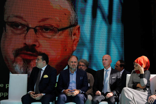 Hatice Cengiz, fiancée of murdered Saudi journalist Jamal Khashoggi, and Jeff Bezos, owner of The Washington Post, attend a ceremony marking the anniversary of Khashoggi's killing on October 2, 2019. (Reuters/Umit Bektas)