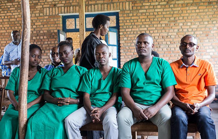 Four Iwacu journalists, (L to R) Agnes Ndirubusa, Christine Kamikazi, Egide Harerimana, Terence Mpozenzi, and the driver Adolphe Masabarakiza, appear at the High Court in Bubanza, western Burundi, on December 30, 2019. The court today convicted the journalists on state security charges. (AFP/Tchandrou Nitanga)
