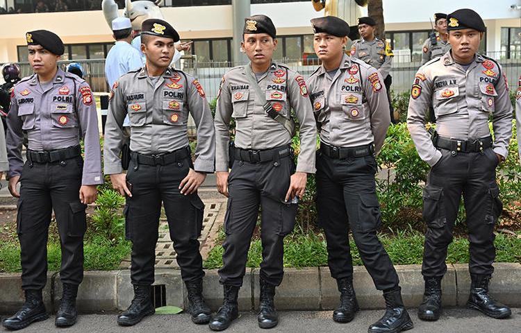 Police officers are seen in Jakarta, Indonesia, on April 7, 2019. Authorities recently arrested and detained U.S. environmental journalist Philip Jacobson. (AFP/Adek Berry)