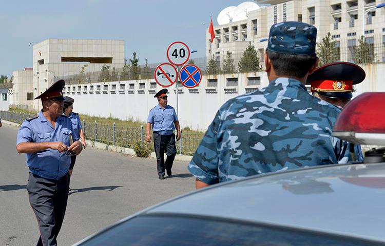 Kyrgyz police officers are seen in Bishkek on August 30, 2016. Kyrgyz journalist Bolot Temirov was assaulted today in Bishkek. (AP/Vladimir Voronin)