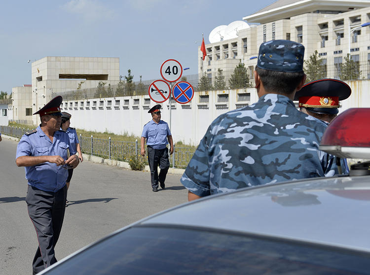 Kyrgyz police officers are seen in Bishkek on August 30, 2016. Kyrgyz journalist Bolot Temirov was assaulted today in Bishkek. (AP/Vladimir Voronin)