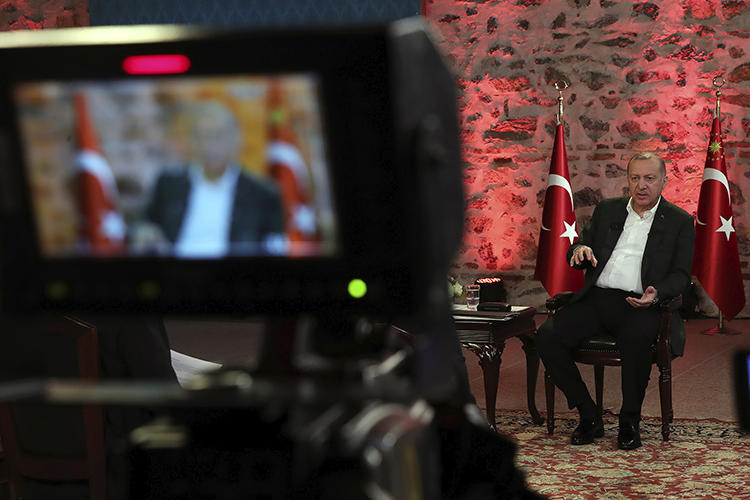 Turkish President Recep Tayyip Erdogan gives a televised interview in Istanbul on January 5, 2020. The Turkish government recently cancelled hundreds of journalists' press passes. (Presidential Press Service via AP)