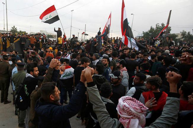 Iraqi demonstrators gather in Basra on January 10. Gunmen killed two journalists from the Iraqi broadcaster Dijlah TV, who were covering the protests. (Reuters/Essam al-Sudani)