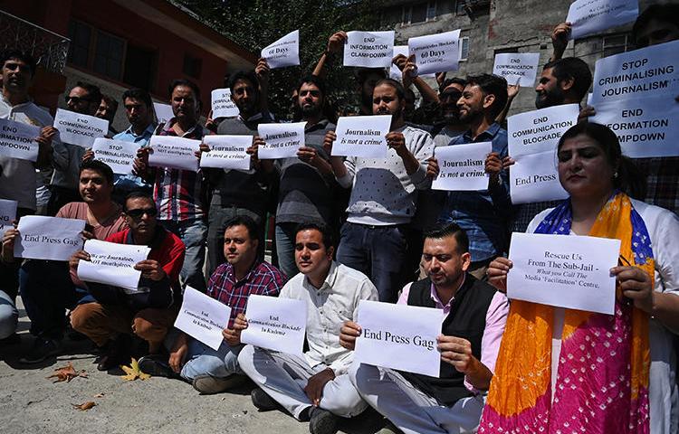 Journalists protest against restrictions of the internet and mobile phone networks at the Kashmir Press Club in Srinagar in October 2019. Jammu and Kashmir police have questioned three journalists this month, and internet access has yet to be fully restored. (AFP/Tauseef Mustafa)