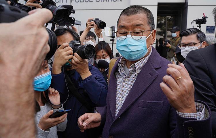 Jimmy Lai, founder of Hong Kong's Apple Daily newspaper, leaves a police station in Hong Kong on February 28, 2020 after being held over his participation in a pro-democracy protest. Lai's independent media house has been harassed for its pro-democracy stance. (The Initium Media via AP/Lam Chun Tung)