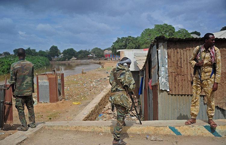 Somalia's soldiers patrol in Afgooye, some 30 km south of the Somali capital, Mogadishu, on October 19, 2016. Somali broadcast journalist Abdiwali Ali Hassan was gunned down in Afgooye on February 16, 2020. (AFP/Mohamed Abdiwahab)