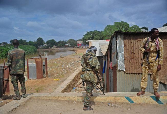 Somalia's soldiers patrol in Afgooye, some 30 km south of the Somali capital, Mogadishu, on October 19, 2016. Somali broadcast journalist Abdiwali Ali Hassan was gunned down in Afgooye on February 16, 2020. (AFP/Mohamed Abdiwahab)