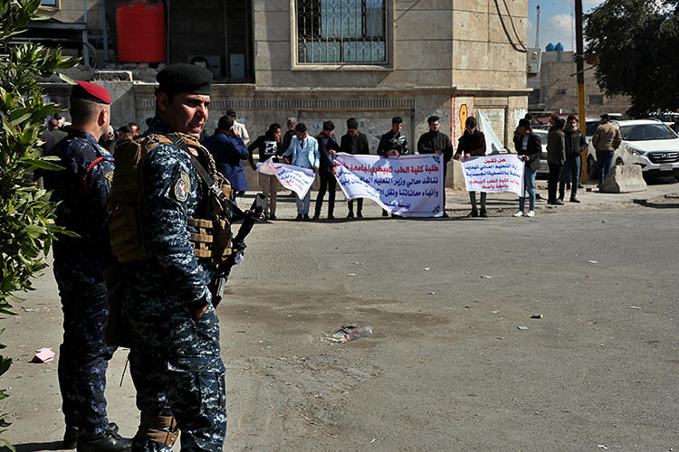 Security forces are seen in Baghdad, Iraq, on February 10, 2020. Al-Rasheed TV chief executive officer Nizar Thanoun was recently shot and killed in Baghdad. (AP/Hadi Mizban)