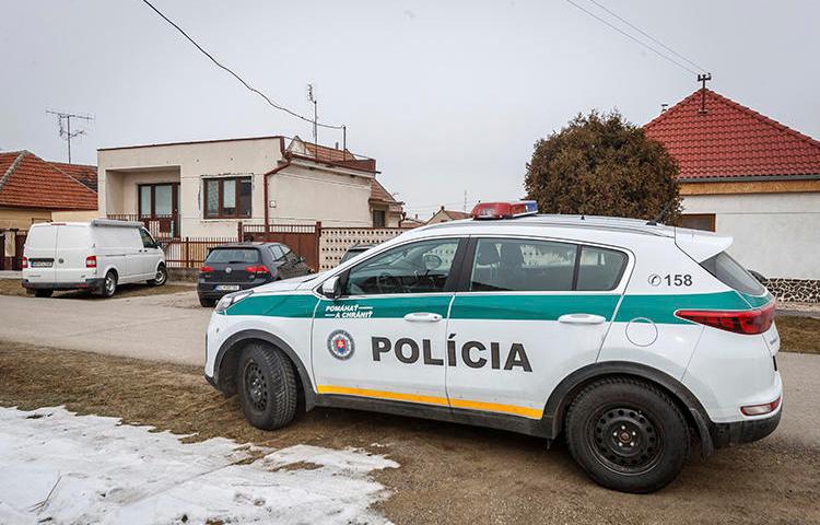 A police car is seen in Velka Maca, Slovakia, on February 27, 2018. Slovak authorities recently charged journalist Michal Havran with criminal defamation and slander. (AP/Michal Smrcok/News and Media Holding)