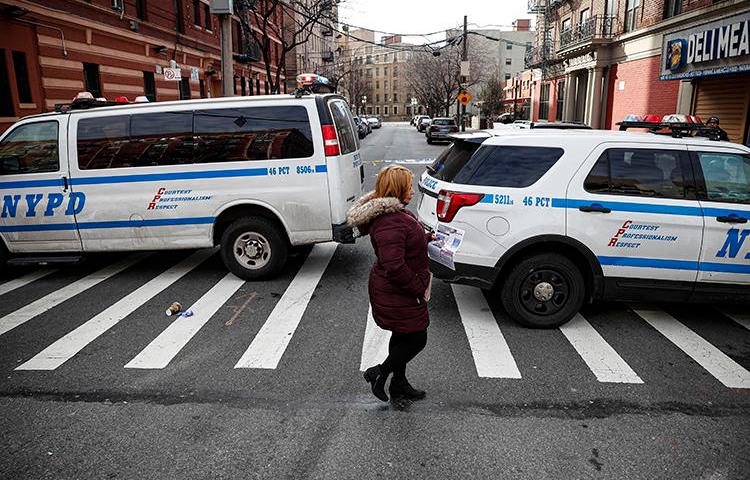 New York City police vehicles are seen on February 9, 2020. The NYPD recently cited anti-terrorism legislation in a subpoena seeking a journalist's data from Twitter. (AP/John Minchillo)