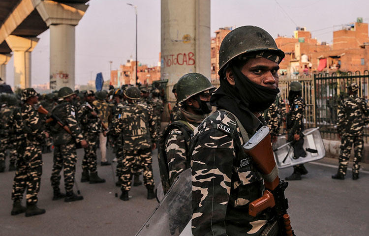 Paramilitary troops are seen in New Delhi, India, after clashes erupted between people demonstrating for and against a new citizenship law on February 25, 2020. (Reuters/Danish Siddiqui)