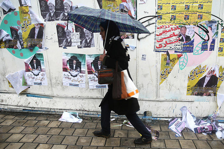 Campaign posters pictured in Tehran on February 20. Ahead of parliamentary elections, authorities increased pressure on Iran's journalists with arrests, detentions and legal action. (Supplied to Reuters via West Asia News Agency/Nazanin Tabatabaee)