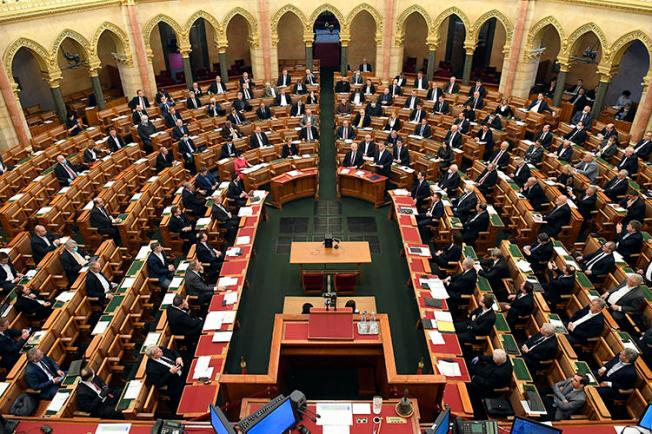 Prime Minister Viktor Orban is seen in the House of Parliament in Budapest, Hungary, on March 23, 2020. The parliament is considering amendments to the country's penal code that could imprison journalists covering the COVID-19 outbreak. (AP/Tamas Kovacs/MTI)