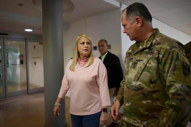 Governor Wanda Vazquez and National Guard general Jose Reyes tour screening stations established to detect the new coronavirus on arriving passengers at the Luis MuÃ±oz Marin Airport in Carolina, Puerto Rico, on March 16, 2020. Reporter Bárbara Figueroa Rosa described the challenges of covering Puerto Rico’s coronavirus outbreak. (AP Photo/Carlos Giusti)