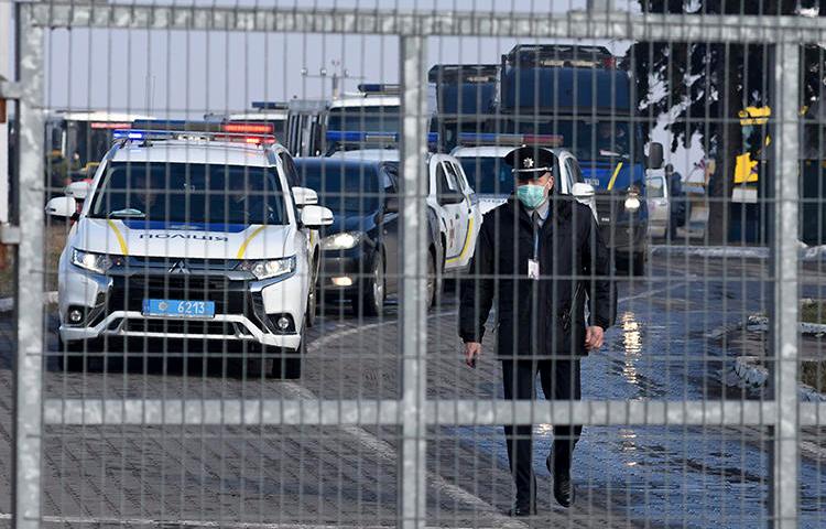 Police officers are seen in Kharkiv, Ukraine, on February 20, 2020. Local investigative outlet Slidstvo.Info is potentially facing a criminal investigation for its reporting. (AP/Igor Chekachkov)