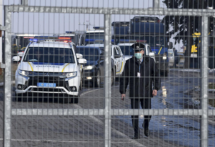 Police officers are seen in Kharkiv, Ukraine, on February 20, 2020. Local investigative outlet Slidstvo.Info is potentially facing a criminal investigation for its reporting. (AP/Igor Chekachkov)