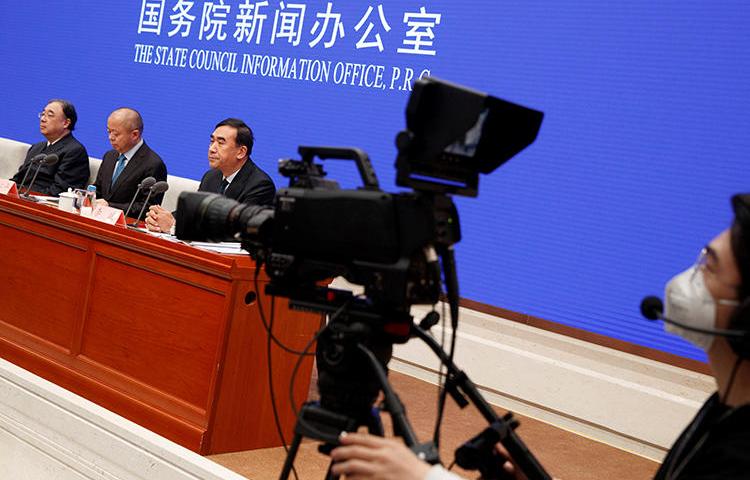 A journalist is seen filming a conference in Beijing, China, on January 26, 2020. The Chinese government recently ordered the dismissal of local staffers at several U.S. news outlets in Beijing. (Reuters/Thomas Peter)