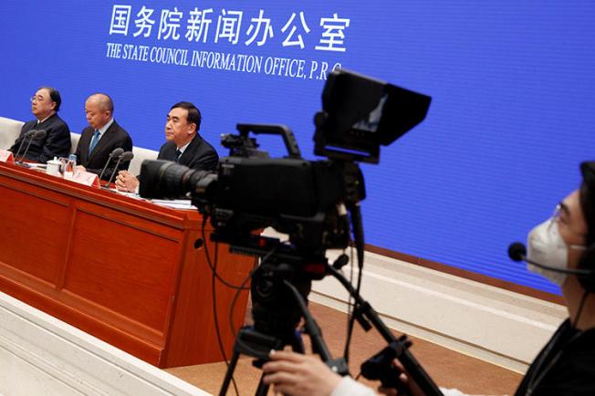 A journalist is seen filming a conference in Beijing, China, on January 26, 2020. The Chinese government recently ordered the dismissal of local staffers at several U.S. news outlets in Beijing. (Reuters/Thomas Peter)