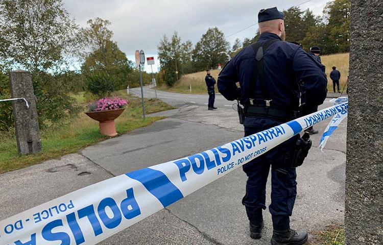 Police are seen outside Stockholm, Sweden, on October 5, 2019. Exiled Pakistani journalist Sajid Hussain Baloch recently went missing in Sweden. (Reuters/Anna Ringstrom)