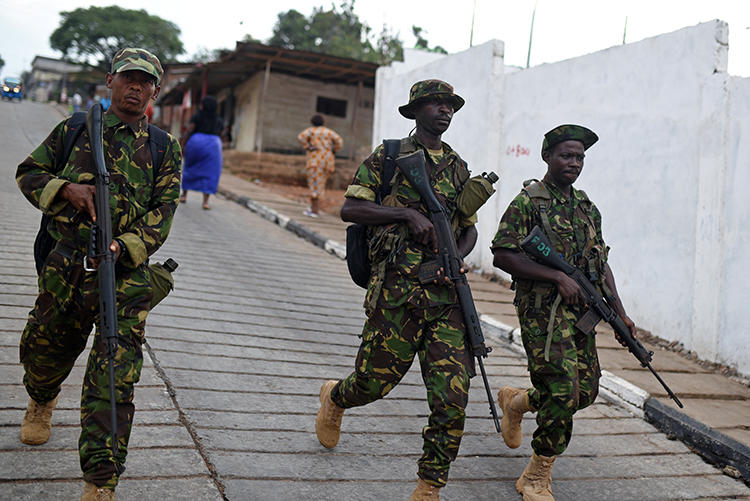 Soldiers are seen in Freetown, Sierra Leone, on March 31, 2018. Security forces recently assaulted and detained journalist Fayia Amara Fayia. (Reuters/Olivia Acland)