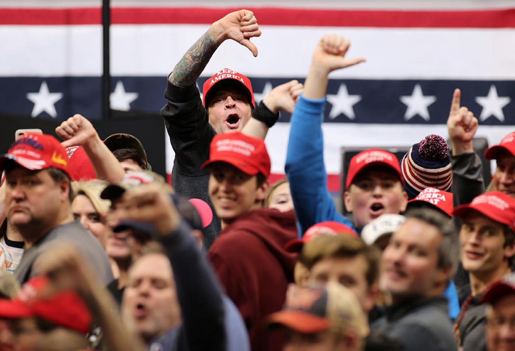 Trump supporters boo the media at a rally in Des Moines, Iowa, on January 30, 2020. Trump regularly taunts the press at his rallies, and encourages the crowd to join in. (Reuters/Jonathan Ernst)