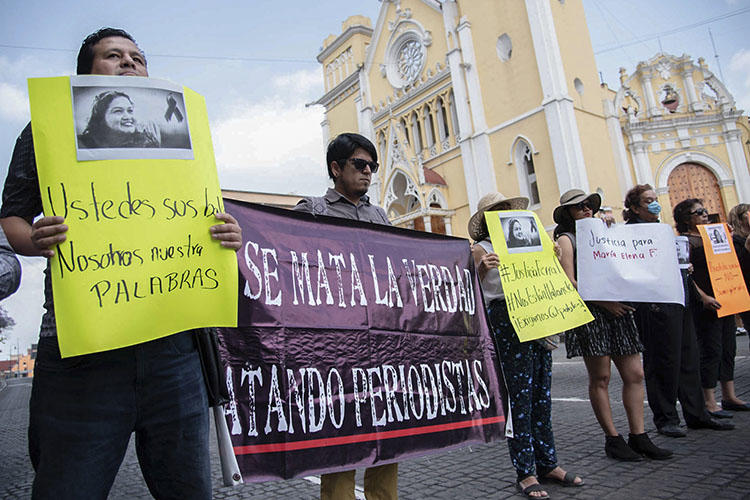 Journalists demonstrate against the killing of their colleague Maria Helena Ferral at Lerdo square in Xalapa, Veracruz state, Mexico on April 1, 2020. (AFP/Hector Quintanar)