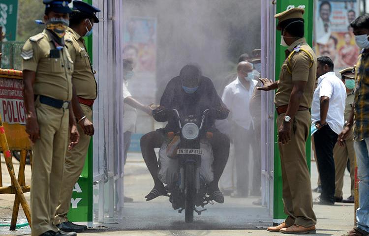 Police are seen in Chennai, Tamil Nadu state, India, on April 5, 2020. Tamil Nadu police recently arrested journalist Andrew Sam Raja Pandian. (AFP/Arun Sankar)