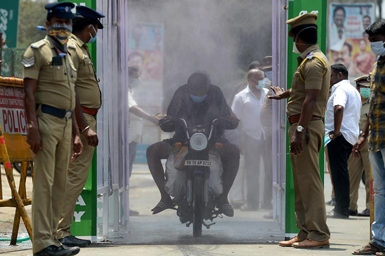 Police are seen in Chennai, Tamil Nadu state, India, on April 5, 2020. Tamil Nadu police recently arrested journalist Andrew Sam Raja Pandian. (AFP/Arun Sankar)