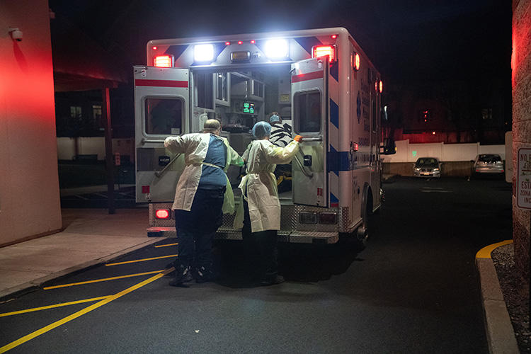 Medics transport a patient to Stamford Hospital on April 2, 2020, in Stamford, Connecticut. (John Moore/Getty Images North America via AFP)